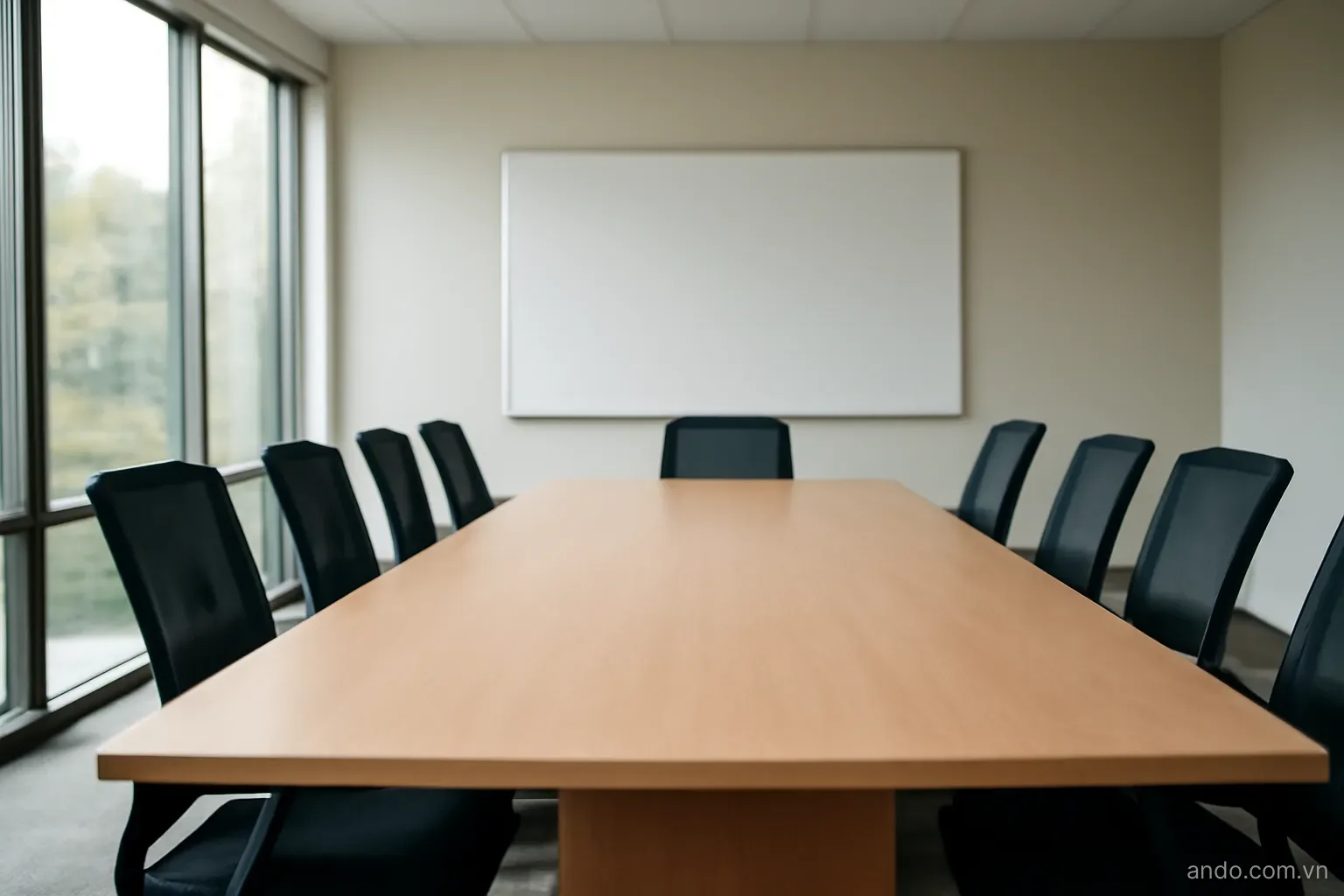 A meeting room with a long table, chairs and a whiteboard, wide view, no text