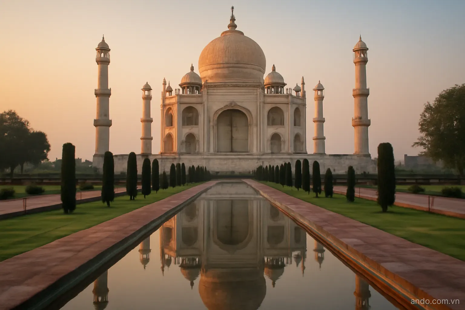 A marble domed monument reflected in a long water channel at dawn, wide view, no text