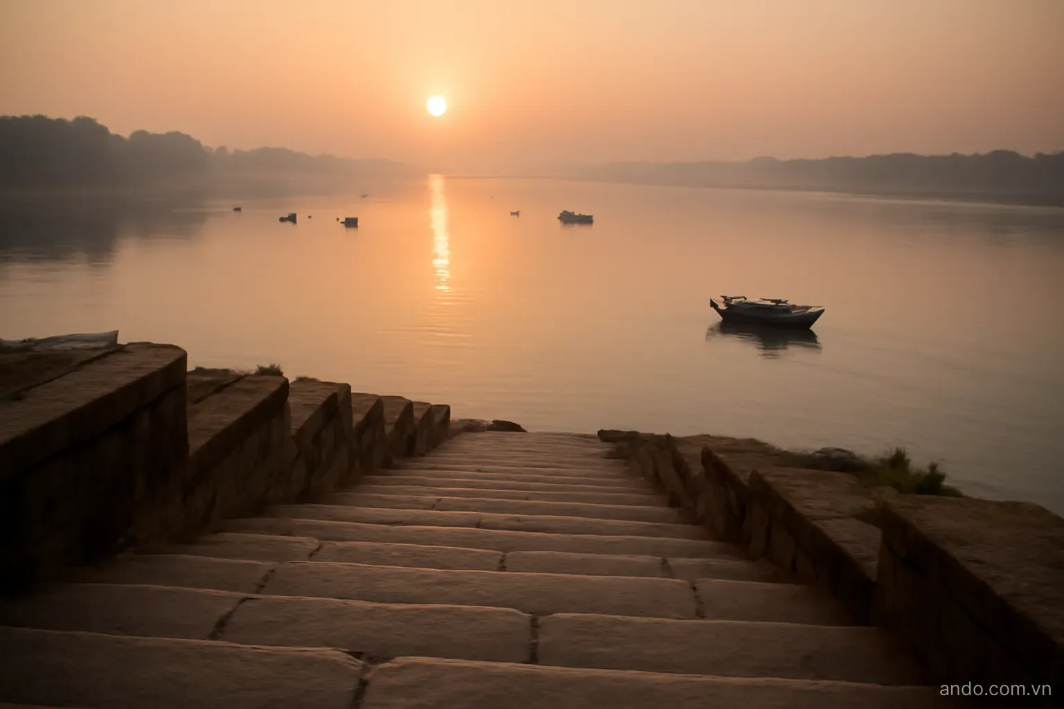 Stone steps descending to a wide river at dawn with small boats on the water, wide view, no text